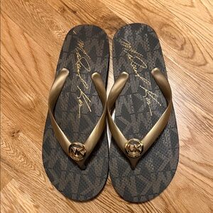 Michael Kors Black and Gold Logo Flip Flops